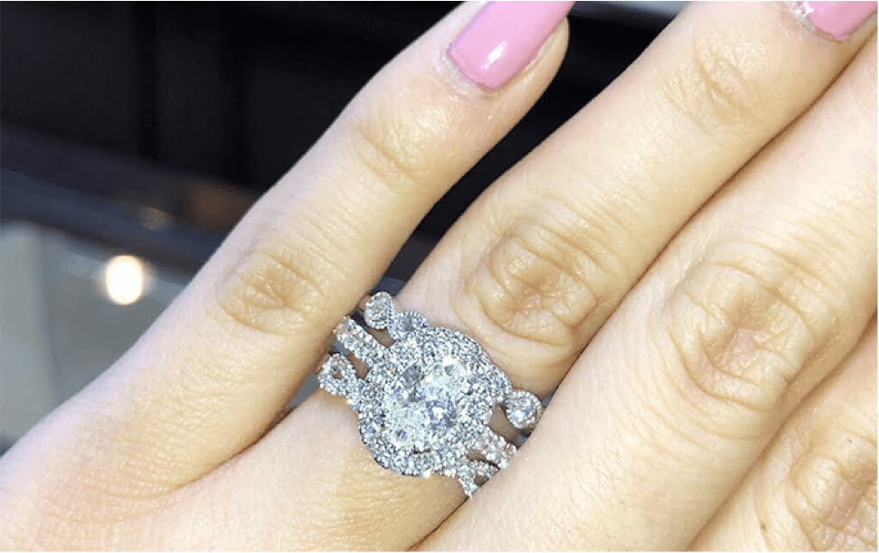 Engagement Rings Displayed On Hand