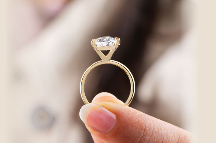 Hand Holding Engagement Ring